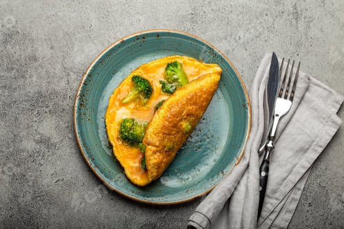 Preview: Healthy omelette with broccoli on plate top view