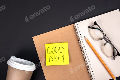 Preview: Open notepad, glasses, cup of coffe, pencil and paper sticker, top view.