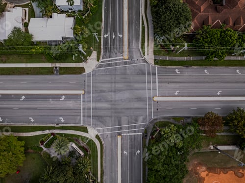 Preview: Top down view directly over a four-way intersection on a sunny day in Florida