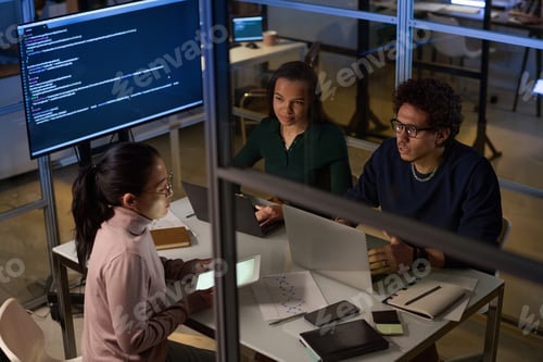 Preview: Group of Coworkers Discussing Issues In Evening