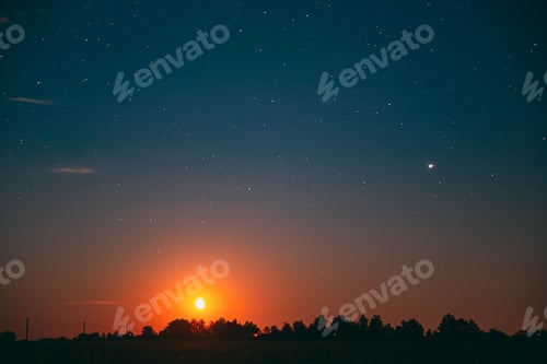 Preview: Moonrise Above Summer Forest park. Night Countryside Summer Starry Night Sky landscape