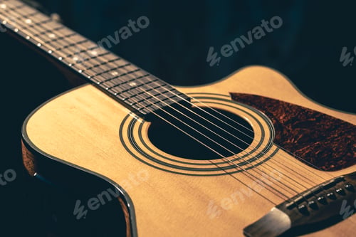 Preview: Musical background with acoustic guitar close up.