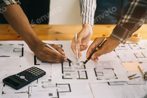 Preview: Person's engineer Hand Drawing Plan On Blue Print with architect equipment.