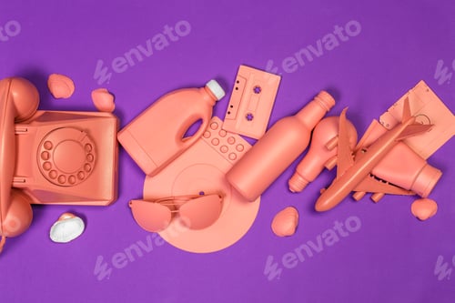 Preview: Colorful collection of orange objects on purple background showcases modern design items