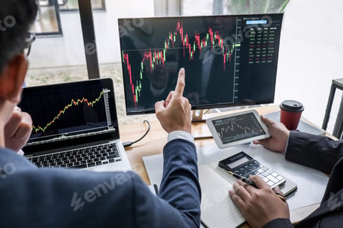 Preview: Business team investment working with computer