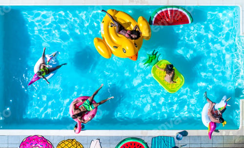 Preview: Friends having fun in a swimming pool