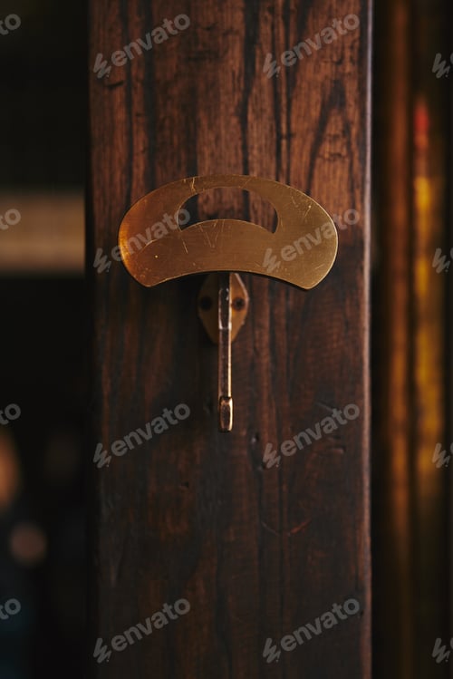 Preview: close-up shot of clothes hanger on wooden wall