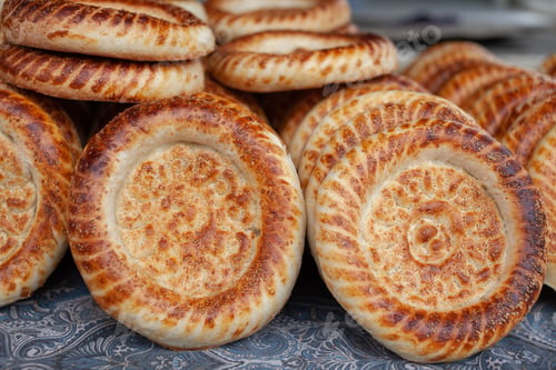 Preview: Typical traditional flatbread with crunchy crust with sesam just baked