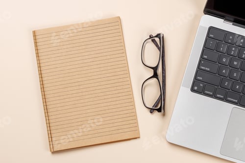 Preview: Blank notepad, laptop and stationery on beige workspace, top view with copy space
