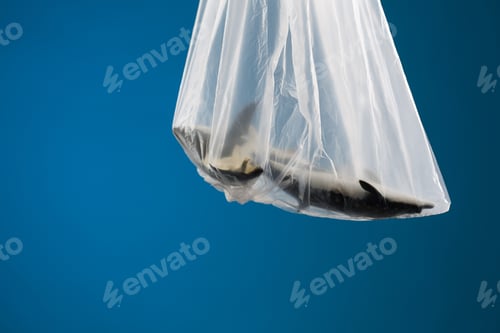 Preview: Ocean Pollution Concept, Toy Whales In Plastic Bag On Blue Background