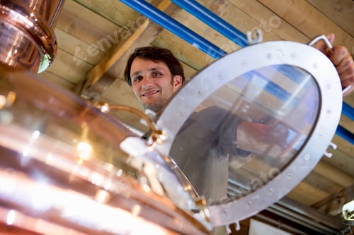 Preview: Male brewer working in brewhouse