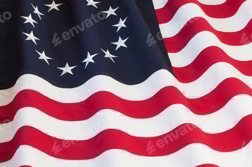 Preview: Waving Patriotic Flag with Thirteen Stars and Stripes
