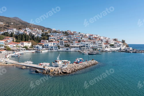 Preview: Andros island, Batsi village, Cyclades Greece. View of traditional building, port, sea, blue sky.