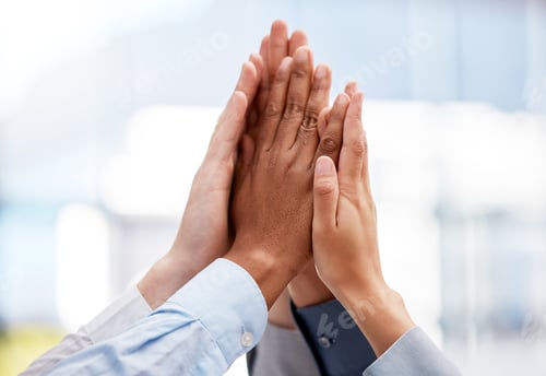 Preview: Hell yeah. Shot of a team of business people high fiving one another.