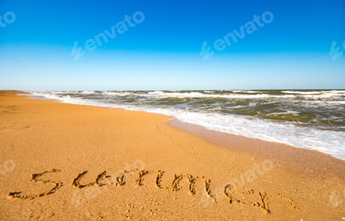 Preview: Inscription on sand summer near stormy sea wave