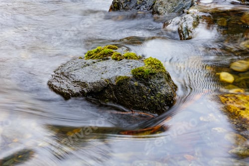 Preview: long exposure of a River stream on mountain valley.