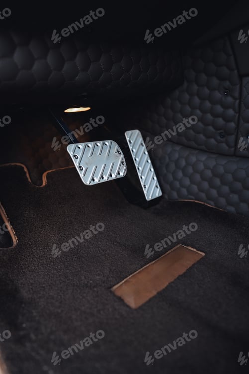 Preview: Close view of car pedals showing modern design and sleek materials in a stylish interior