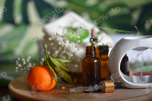 Visualização: Frutas frescas e óleo essencial em frascos escuros para cuidados com a pele. Medicina alternativa saudável