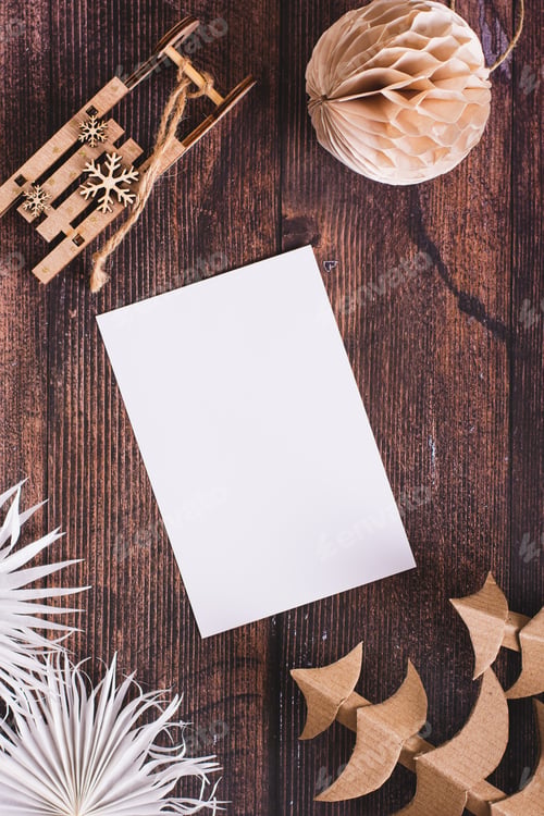 Preview: Blank sheet for gift list in homemade Christmas decorations on table top and vertical view