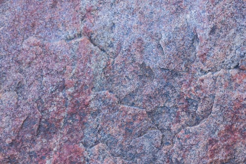 Preview: Texture Of Granite Close Up. Granite Rock With Reddish Color. Background From Solid Stone. Pattern