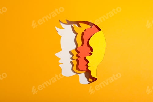 Preview: Children's heads made of paper on a yellow background