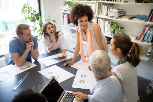 Preview: Successful group of business people at work in office