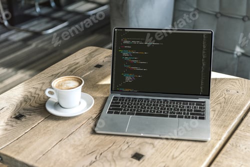 Preview: cup of cappuccino and laptop with program code on screen on rustic wooden table at cafe