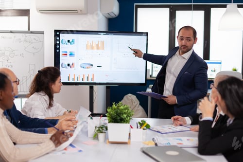 Preview: Manager holding briefing presentation in conference room