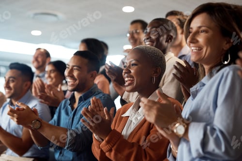 Preview: Shot of a group of young businesspeople clapping during a conference in a modern office