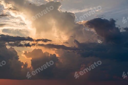 Preview: Sunset sky with bright colorful orange and yellow clouds.