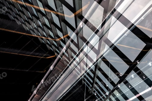 Preview: Windows of the building are reflected in the glass of the escalator