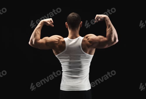 Preview: Unrecognizable man shows strong back muscles closeup