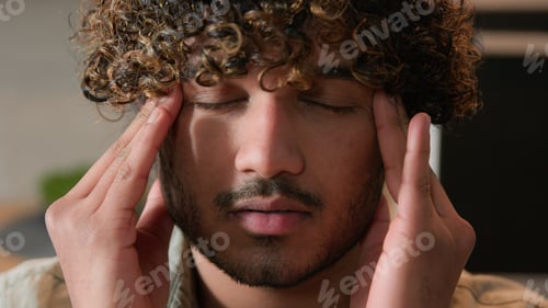 Preview: Close up ill Indian man massaging head pain ache blood pressure business problem bankrupt health