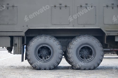 Preview: Close up of green military truck. Modern military transportation vehicle technologies