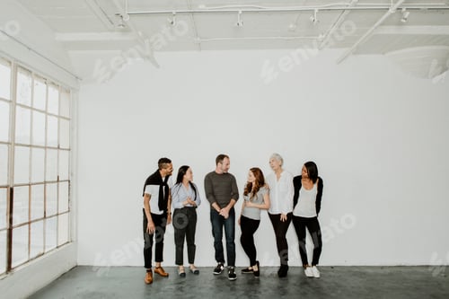 Preview: Smiling Group Enjoying Each Other's Company Indoors
