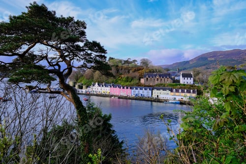 Preview: Beautiful landscape of the Portree town with colorful houses and lake surrounded by rich vegetation