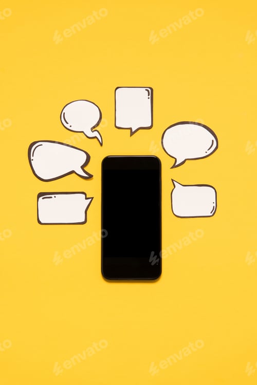Preview: Close-up view of smartphone with black screen and blank speech bubbles isolated on yellow