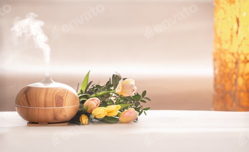 Preview: Aroma oil diffuser lamp on the table .