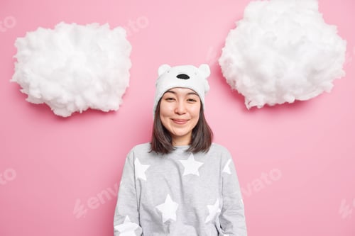 Preview: Good morning concept. Satisfied beautiful Asian woman smiles gently has happy expression dressed in