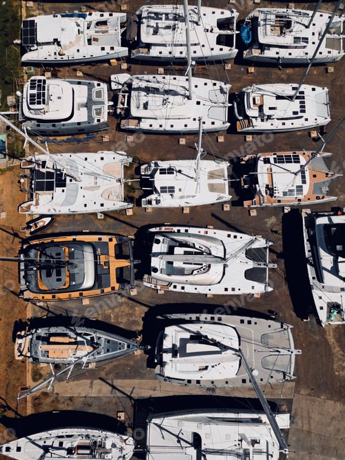 Preview: Aerial view of a cluster of boats moored on the shoreline