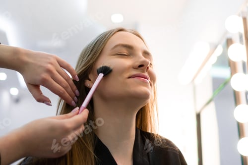 Preview: Portrait of Young Caucasian woman getting cosmetic care at beauty salon