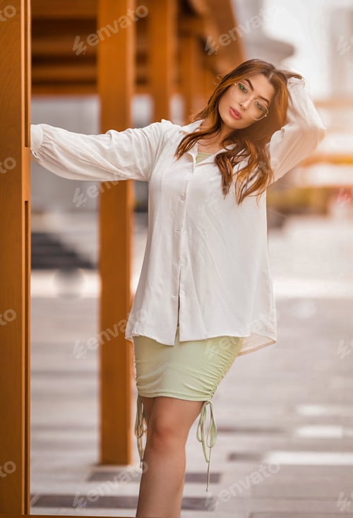 Preview: Incredible young woman with redhead long hair and glasses