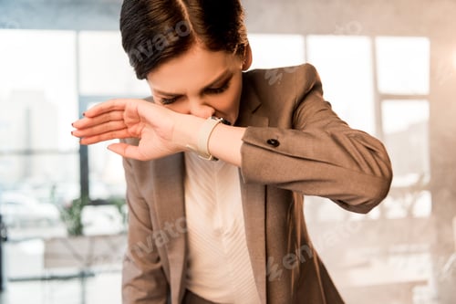 Preview: beautiful scared woman covering nose in office with smoke