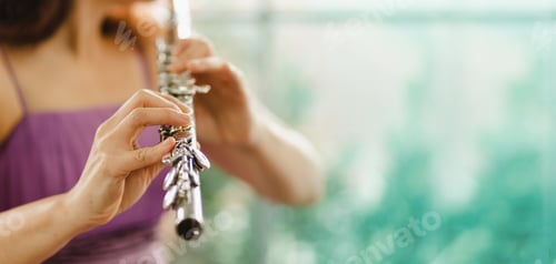 Preview: Musician Woman flutist performs on a musical instrument. Close up of flutist instrument