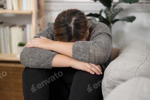 Preview: Sad Overweight plus size woman thinking about problems on sofa upset girl feeling lonely