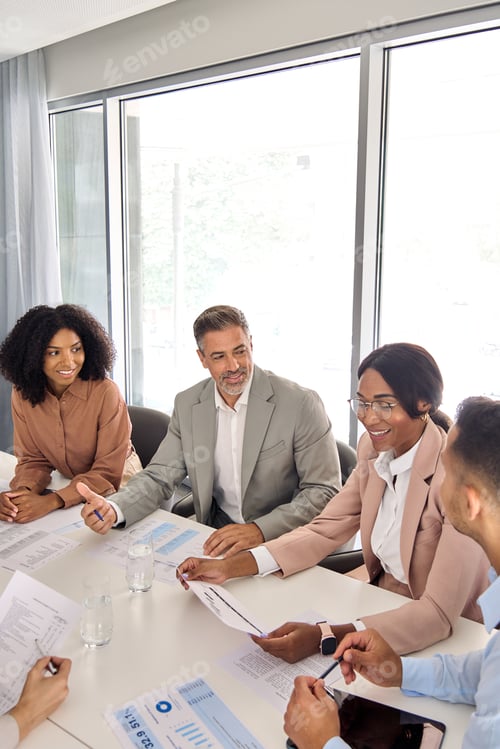 Preview: International executive work group having discussion at office meeting. Vertical