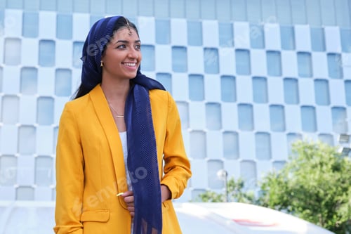 Preview: Portrait of a young indian businesswoman smiling outdoor.