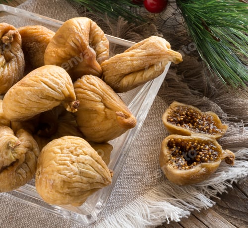 Dried Figs in a Glass Bowl on Wood