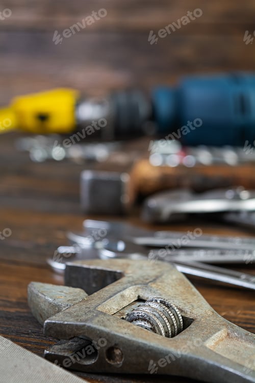 Preview: Set of working tools on wooden rustic background