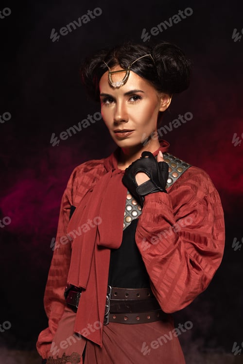 Preview: attractive steampunk woman looking at camera in smoke on black